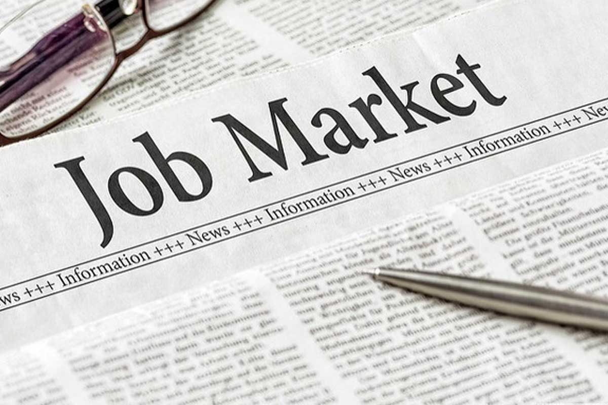 Picture of newspaper headline that reads Job Market