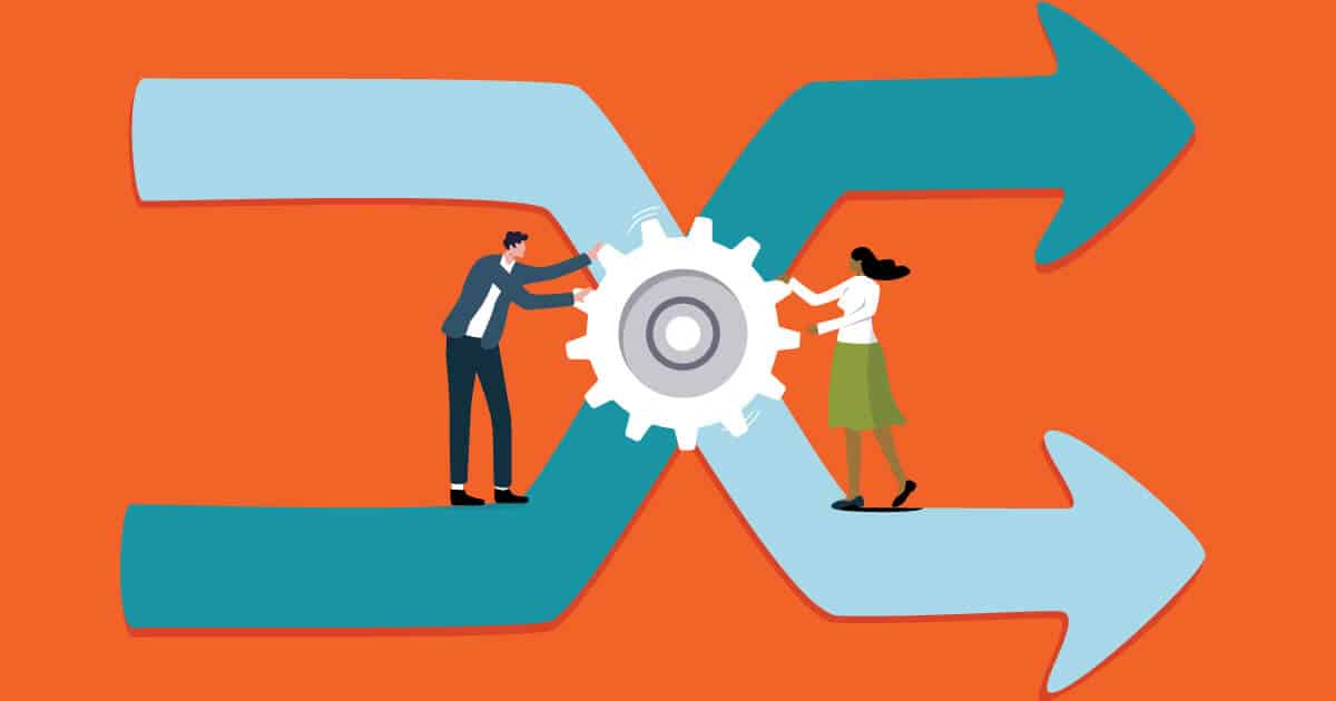 Two people turning a cog to different pathways